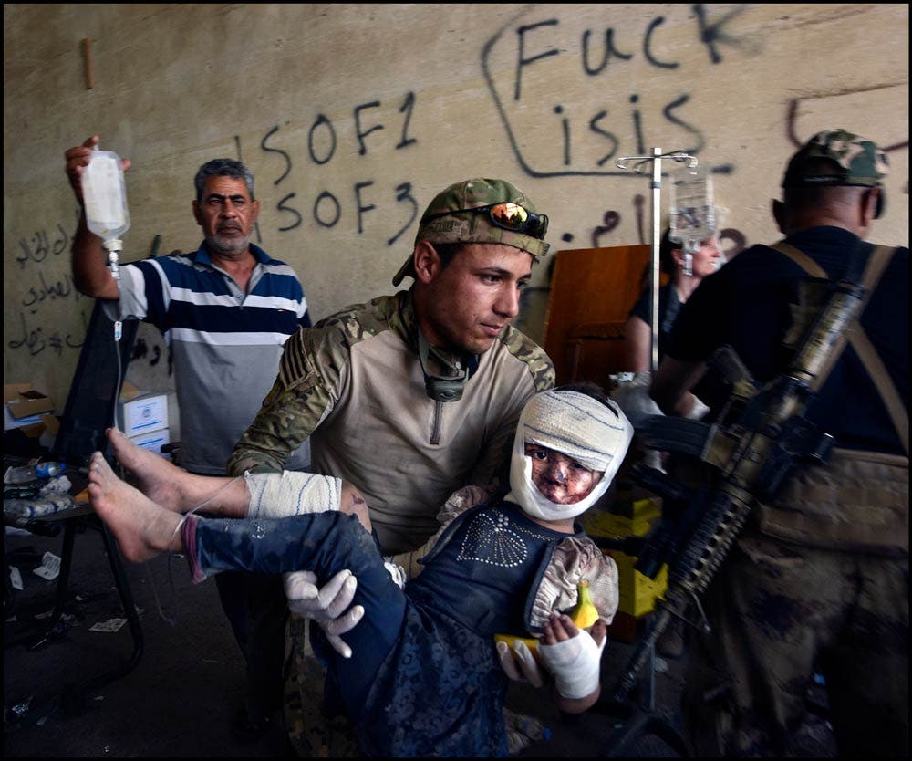 Carol Guzy/Zuma Press isis victims