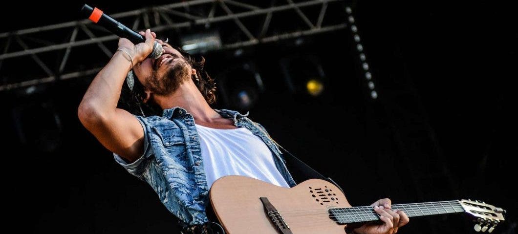 a singer belting into a wireless microphone