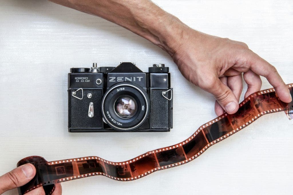photographer pondering what are the best film scanners to use