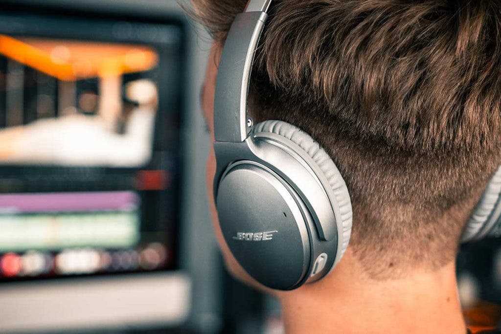 headphones for video editing video editor working at computer