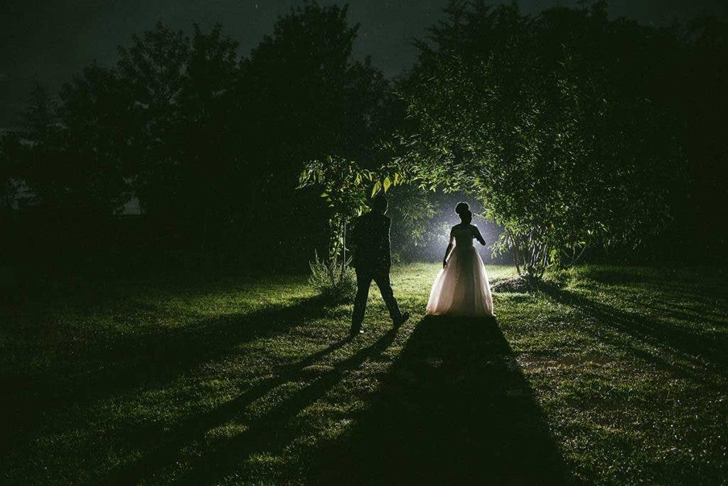 wedding photography nighttime bride groom altar