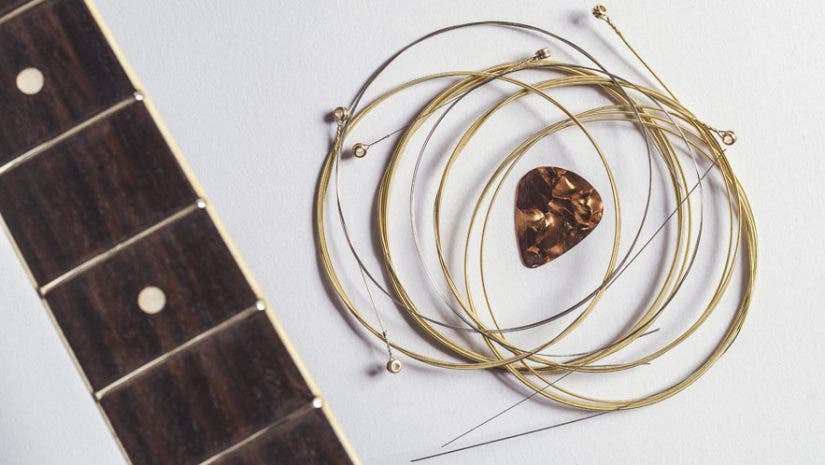 acoustic guitar strings and pick