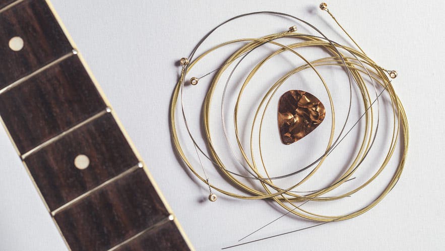 acoustic guitar strings and pick