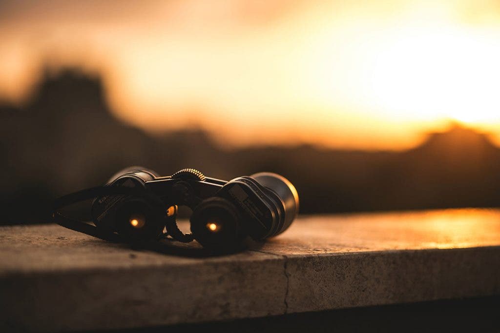 binoculars on ledge during sunset