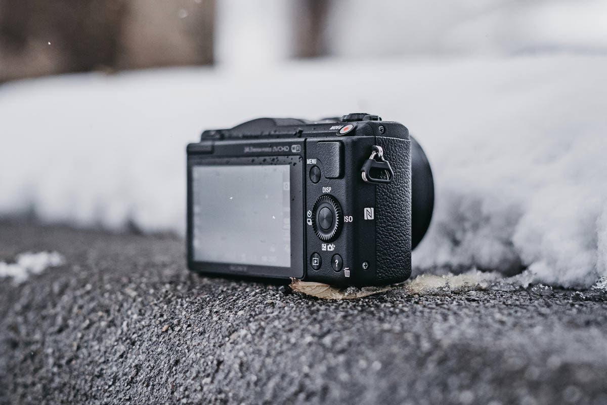 camera sitting on outdoor steps in winter cold weather photography