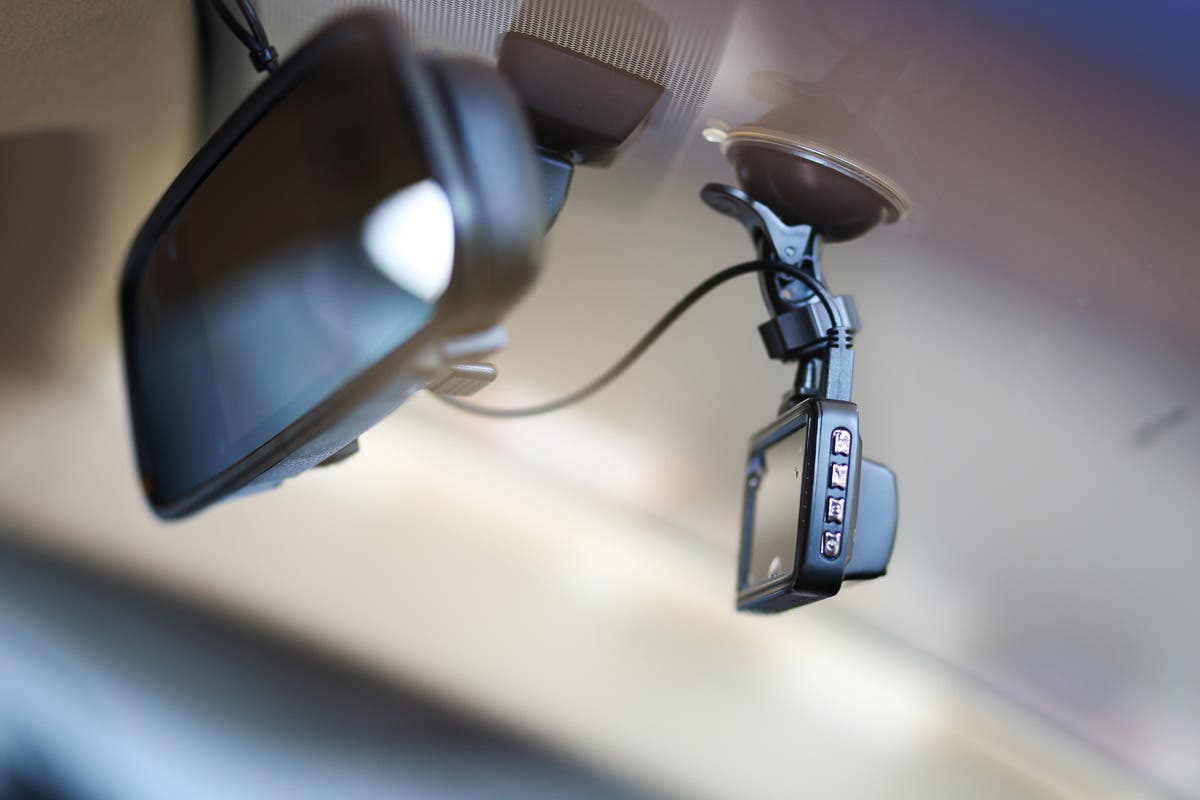 dash cam on rear view mirror of car