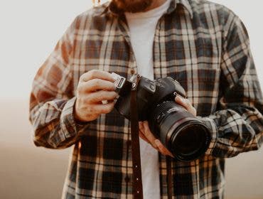 photographer with canon camera camera accessories for growing your photography skill