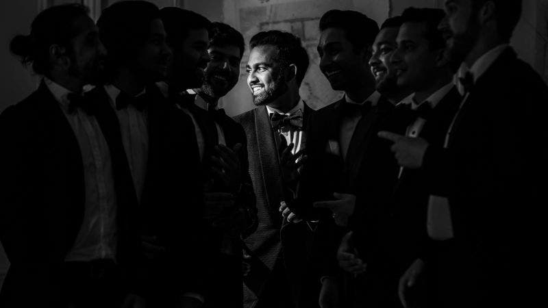 Male model poses with group
