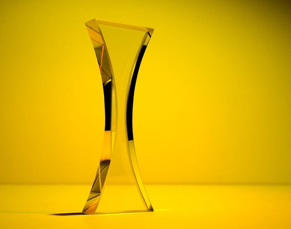 glass statue on yellow background