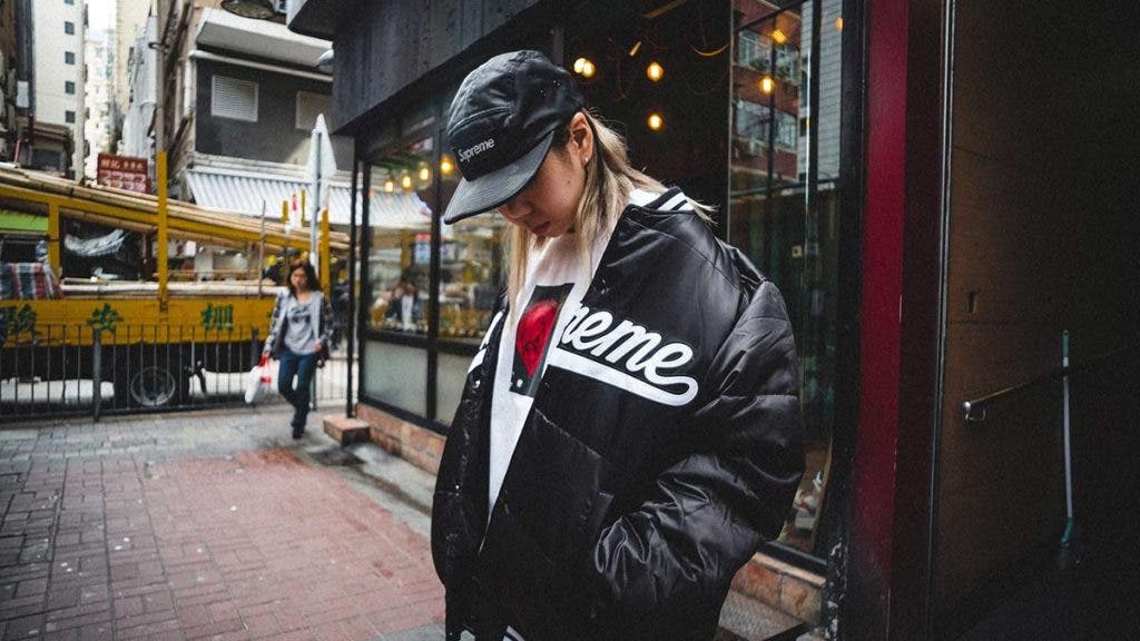 street photography of woman in supreme