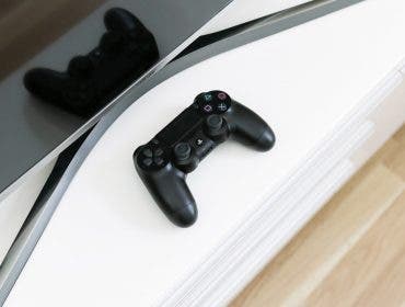 Playstation 4 next to a TV