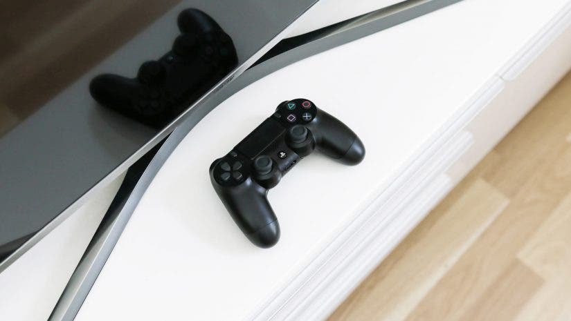 Playstation 4 next to a TV