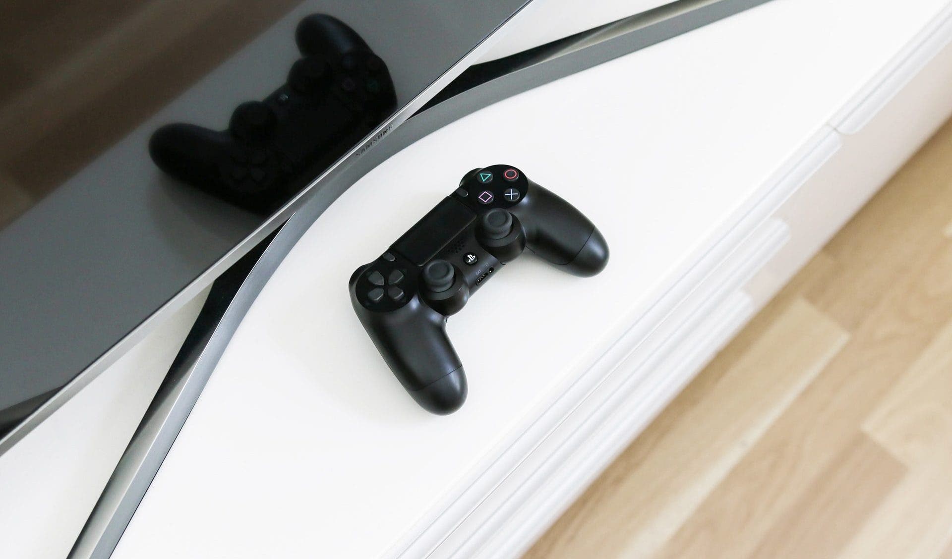 Playstation 4 next to a TV
