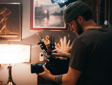 cinematographer filming a documentary