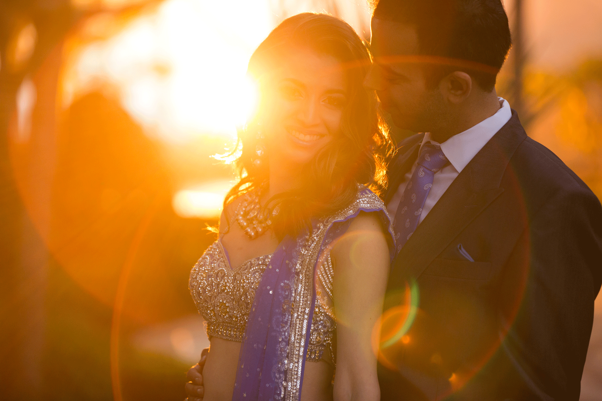 Large light bloom in couples portrait for golden hour photography