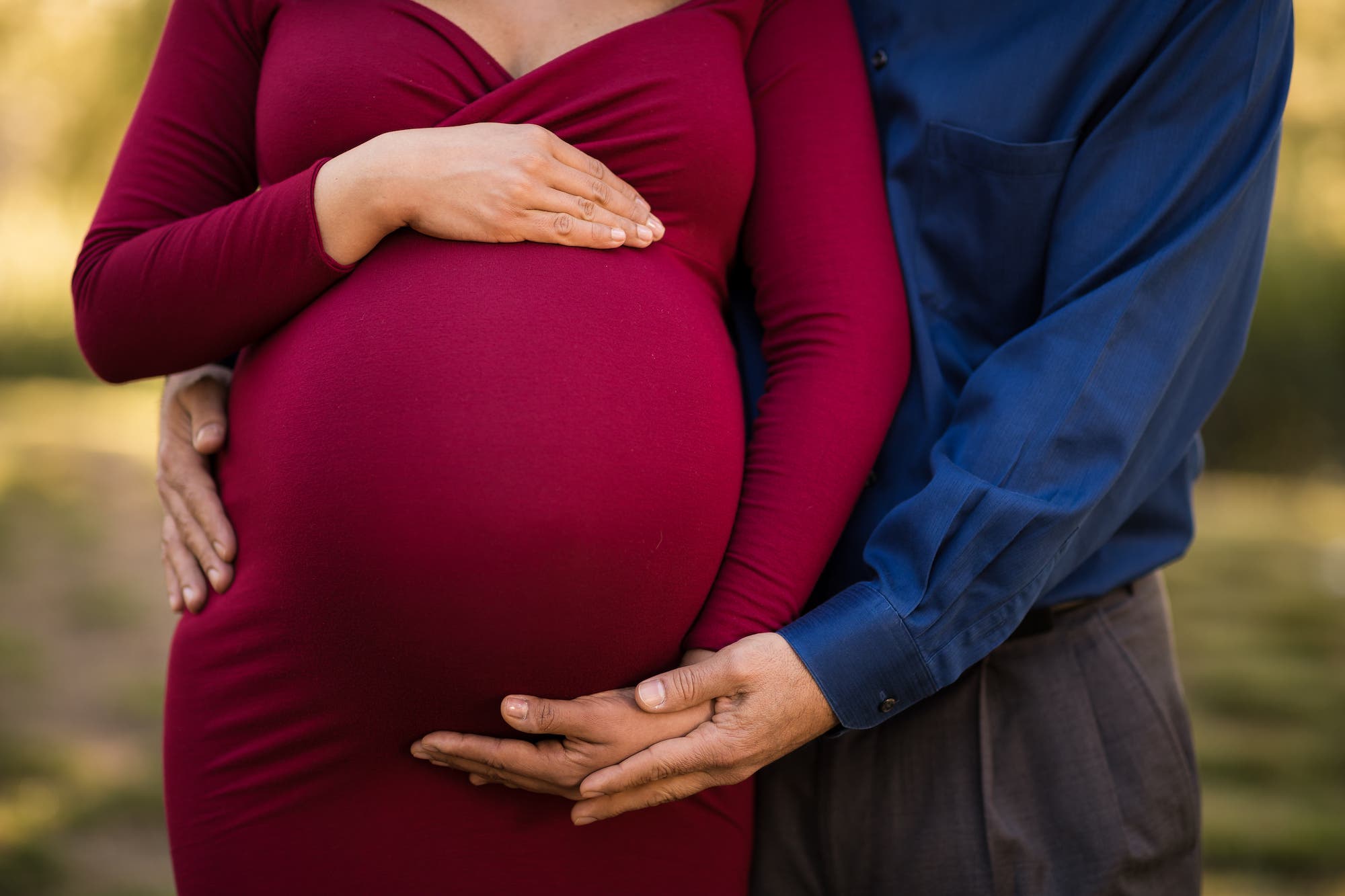 Close up of couple and pregnant belly for maternity pictures