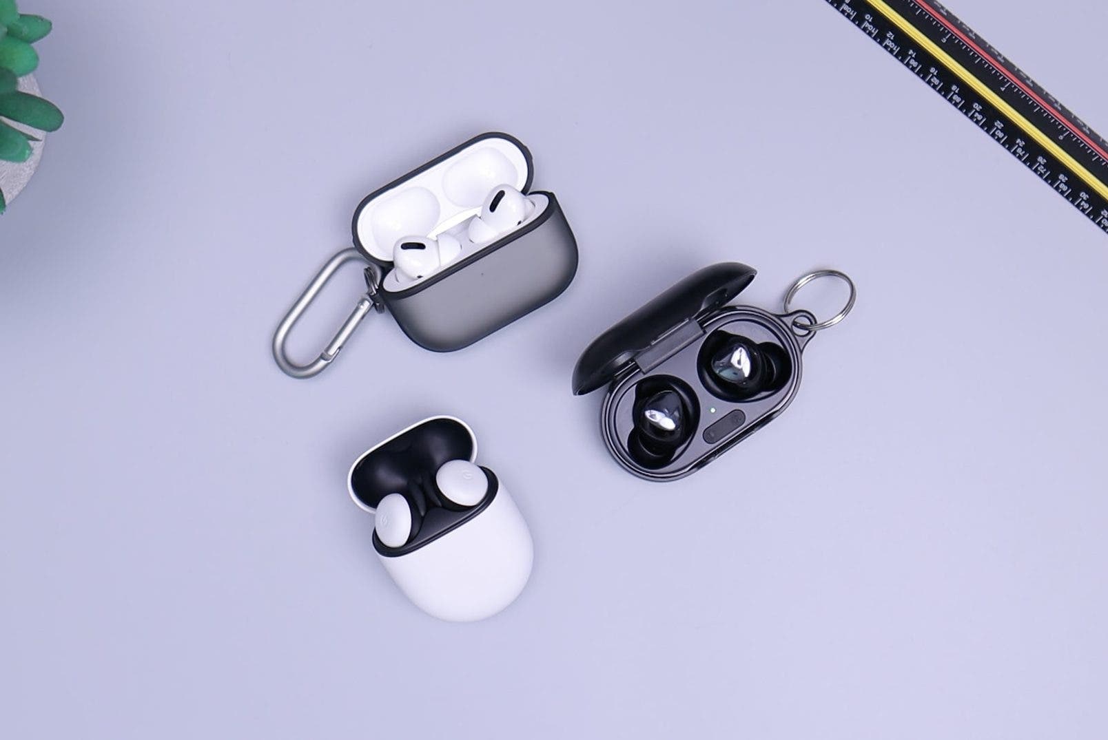 White and black earbuds on a purple background