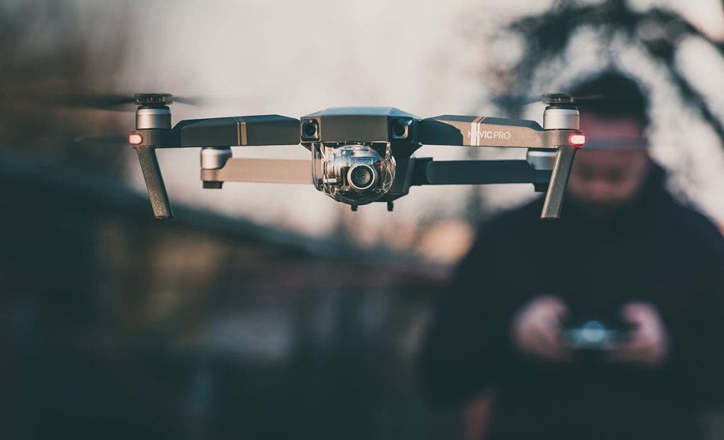 drone pilot flying dji drone