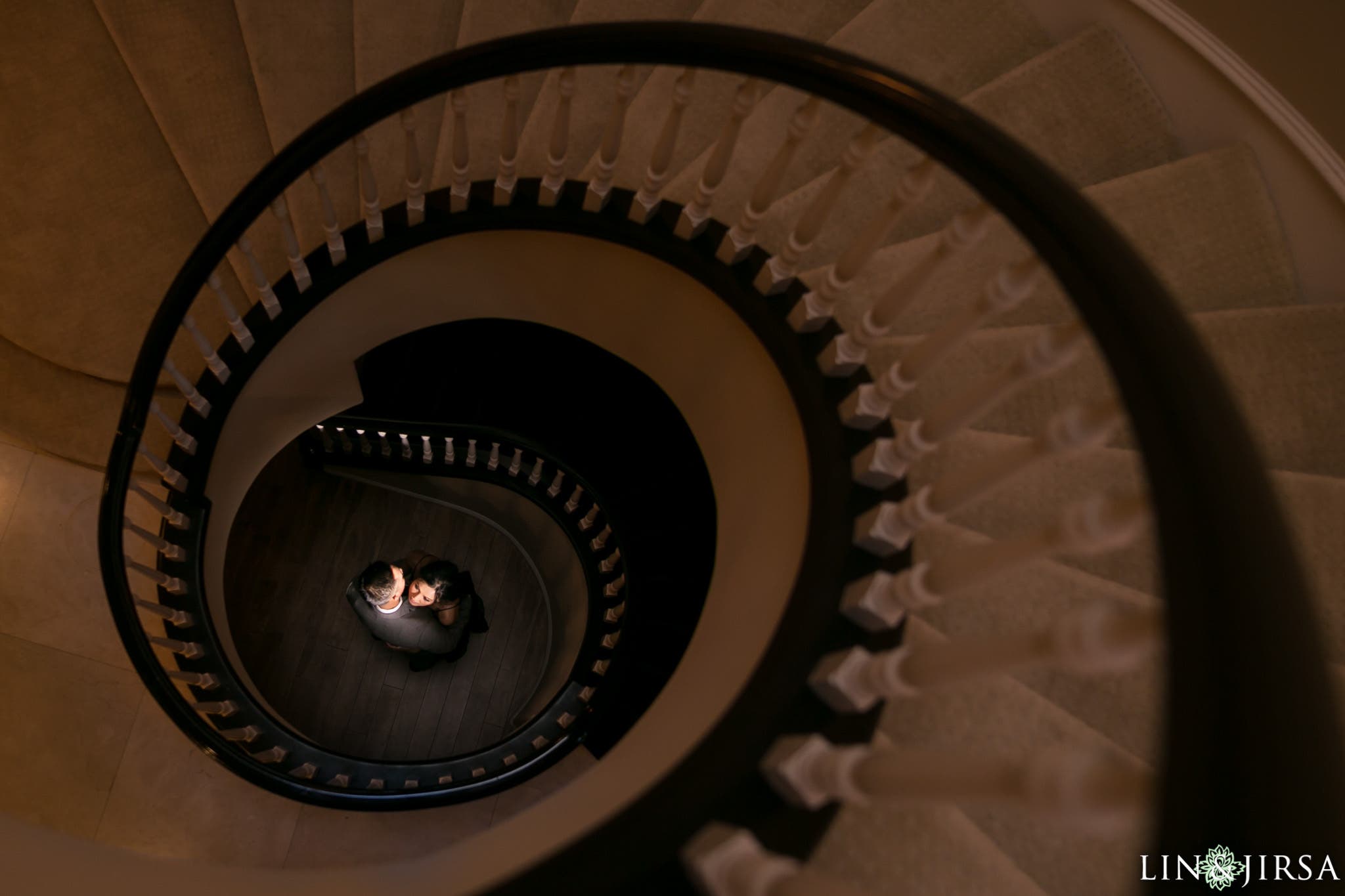 spiral staircase leads to couple