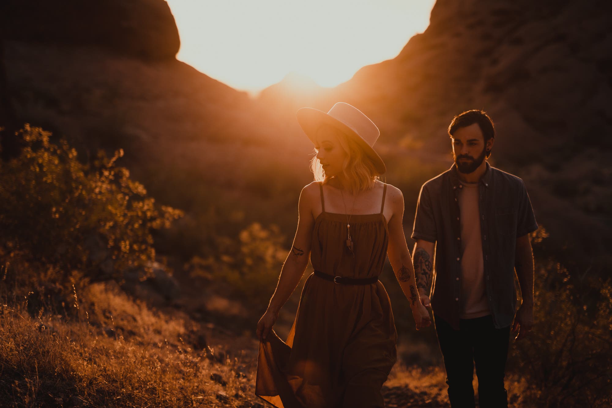 lens flare tips couple walking at sunset
