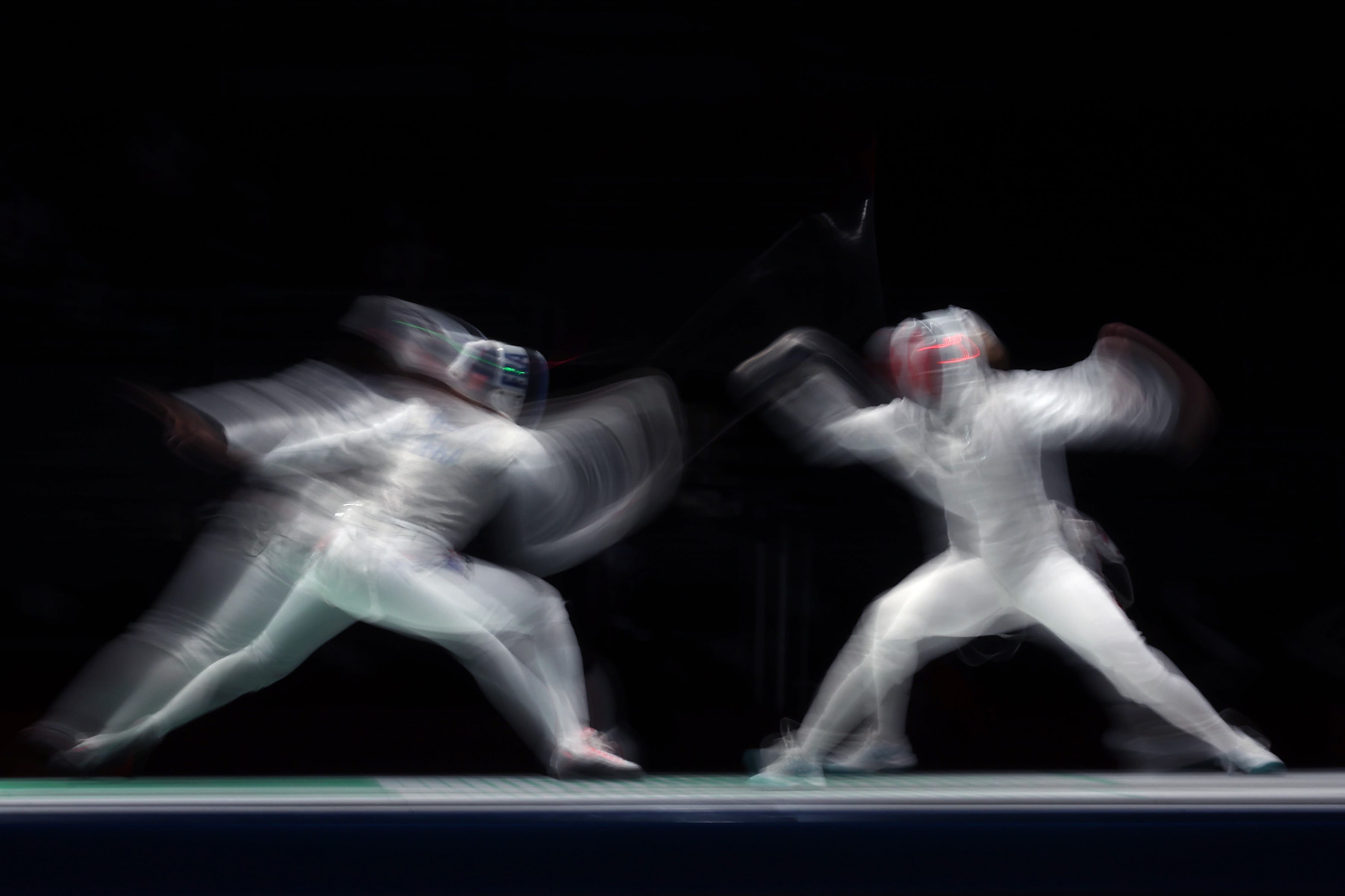 CHIBA, JAPAN - JULY 29: Anita Blaze of Team France, left, competes against Kelleigh Ryan of Team Canada Women's Foil Team Quarterfinal 3 on day six of the Tokyo 2020 Olympic Games at Makuhari Messe Hall on July 29, 2021 in Chiba, Japan. (Photo by Jamie Squire/Getty Images)