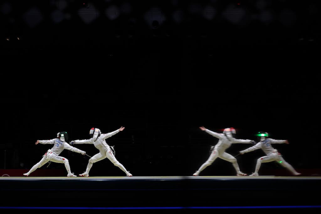 CHIBA, JAPAN - JULY 29: Sera Azuma of Team Japan, left, competes against Noha Hany of Team Egypt Women's Foil Team Quarterfinal on day six of the Tokyo 2020 Olympic Games at Makuhari Messe Hall on July 29, 2021 in Chiba, Japan. (Photo by Jamie Squire/Getty Images)