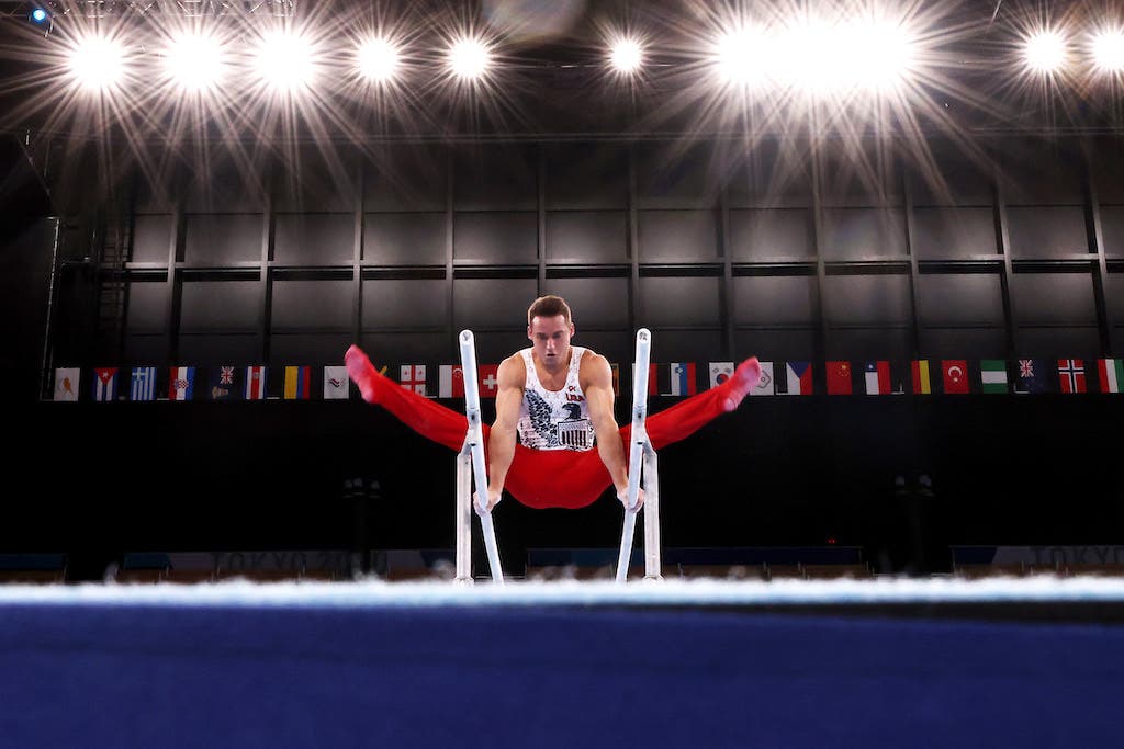 TOKYO, JAPAN - JULY 24: Samuel Mikulak of Team United States competes on parallel bars during Men's Qualification on day one of the Tokyo 2020 Olympic Games at Ariake Gymnastics Centre on July 24, 2021 in Tokyo, Japan. (Photo by Jamie Squire/Getty Images)