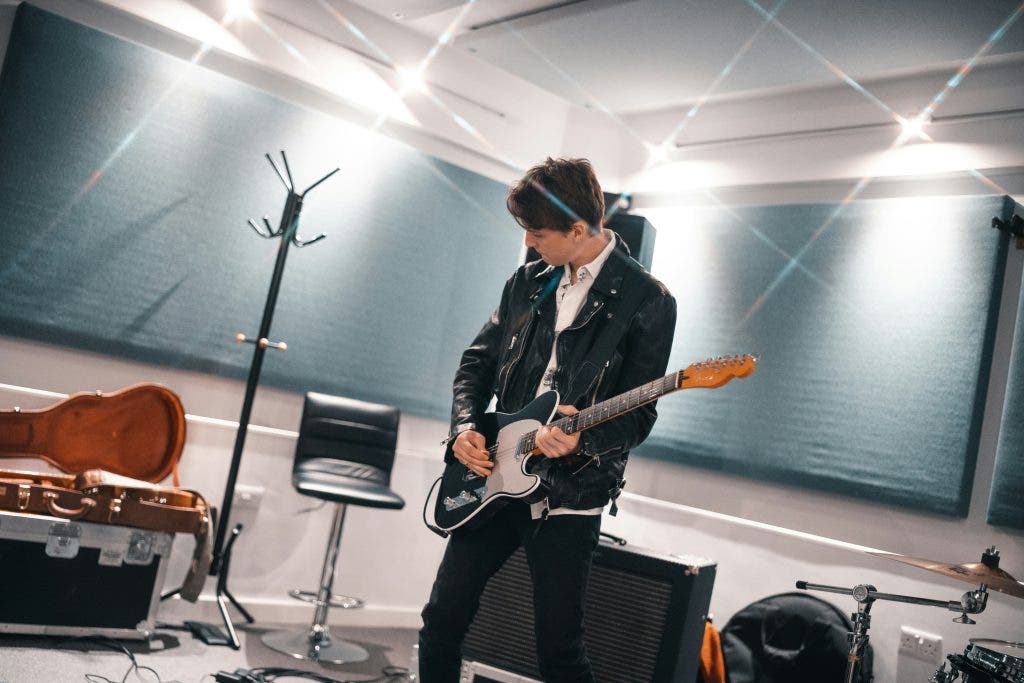 Students in a studio using instrument accessories