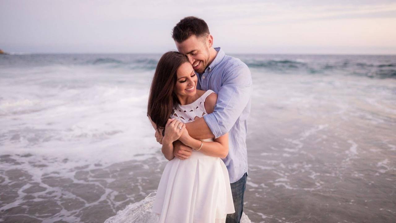 couple embrace on the beach