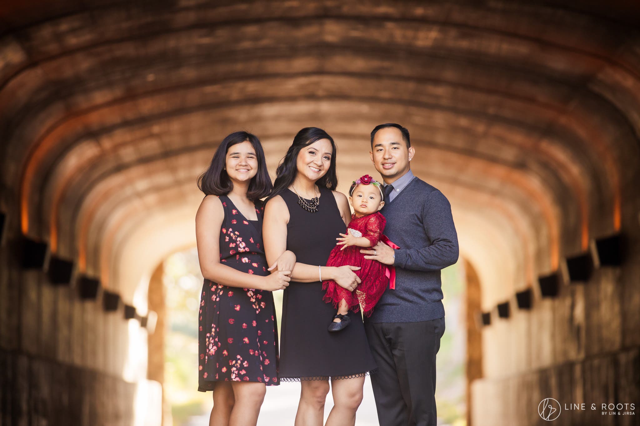 family portrait poses classic pose with family in tunnel