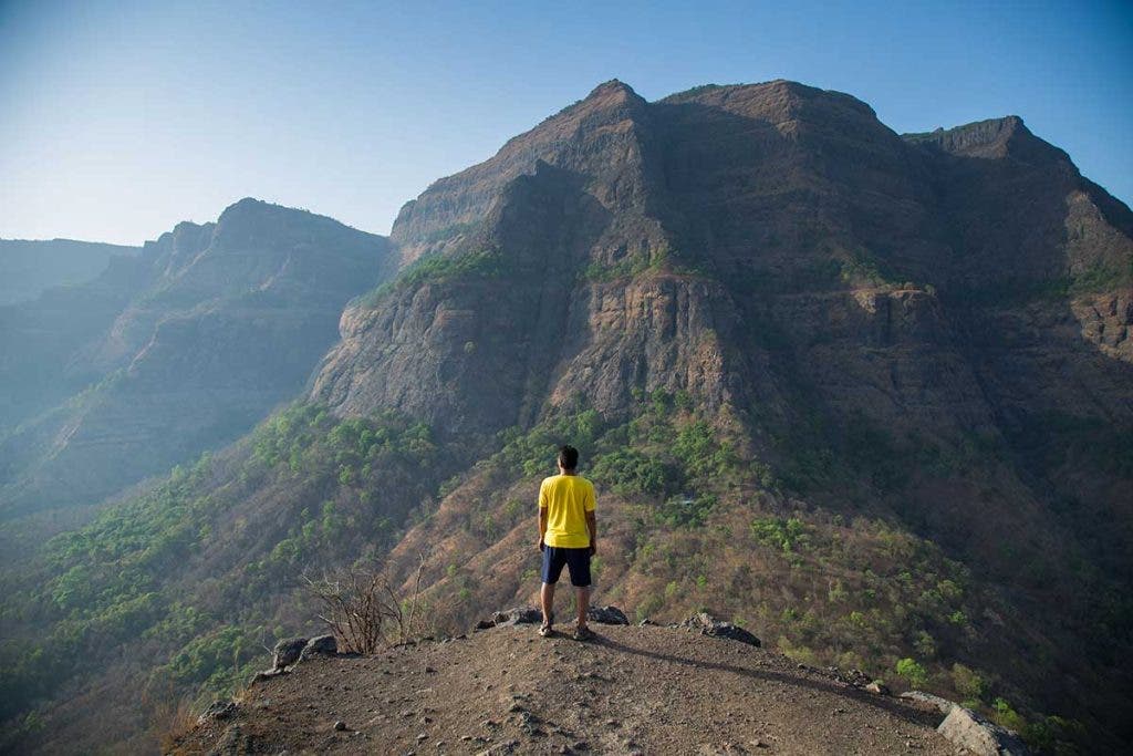 forced perspective of hiker on mountain