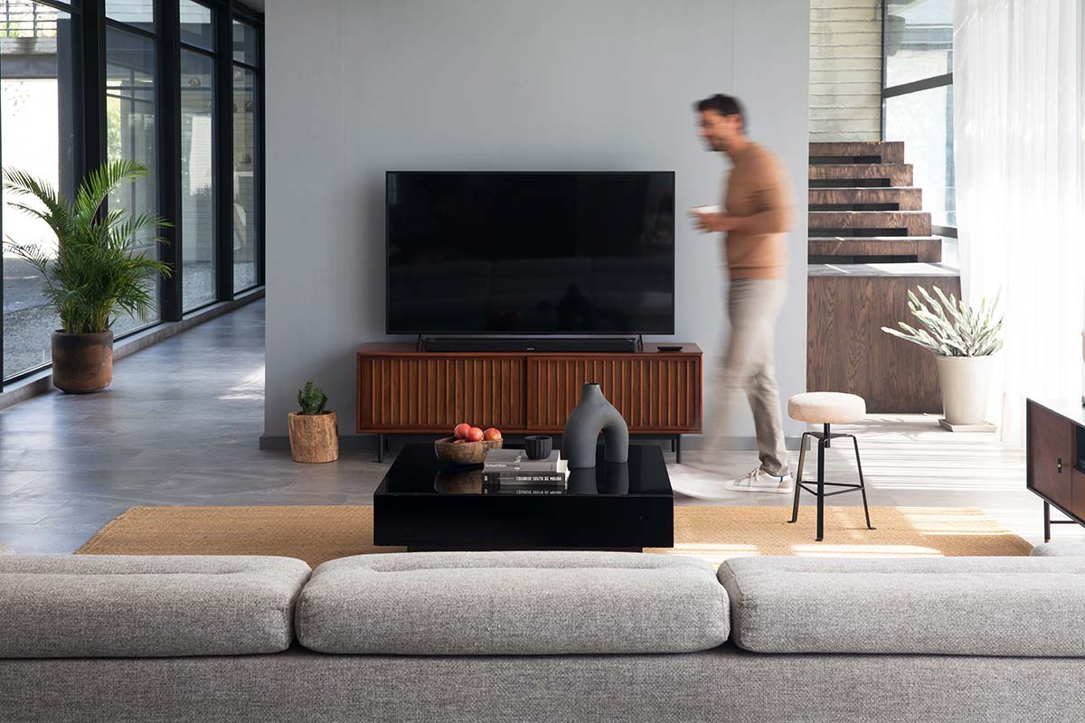 Bose soundbar 900 in living room with man