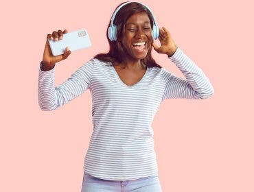 Woman listening to music on noise cancelling headphones.