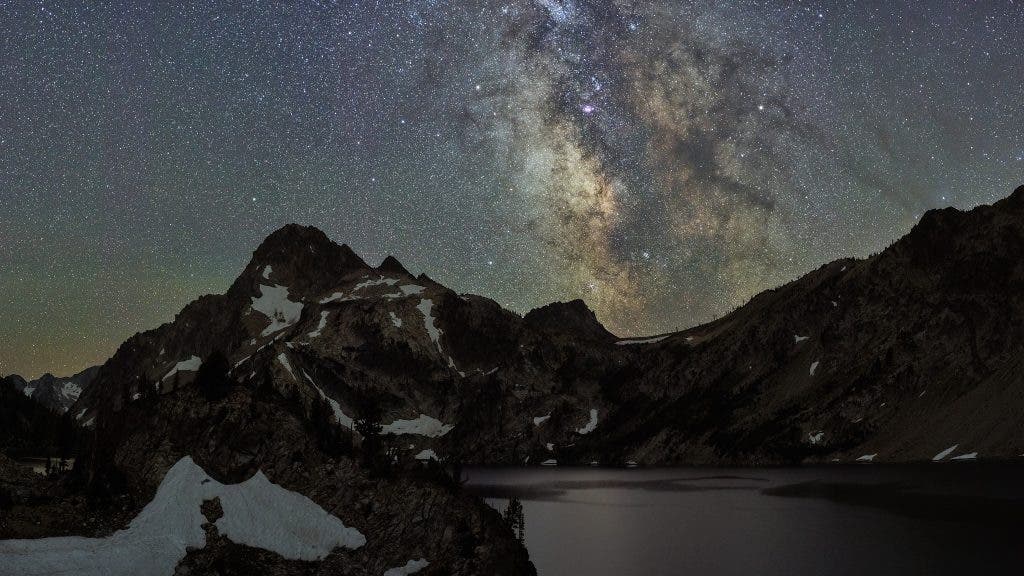 night photography with milky way over mountains