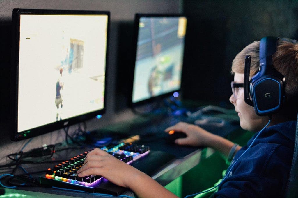 student playing video games in esports club