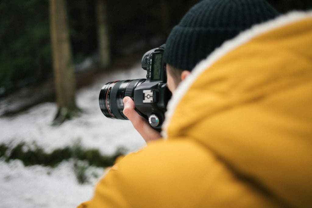 photographer zooming in for sharpened images