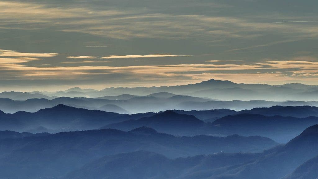Atmospheric or Aerial perspective with mountains and sky