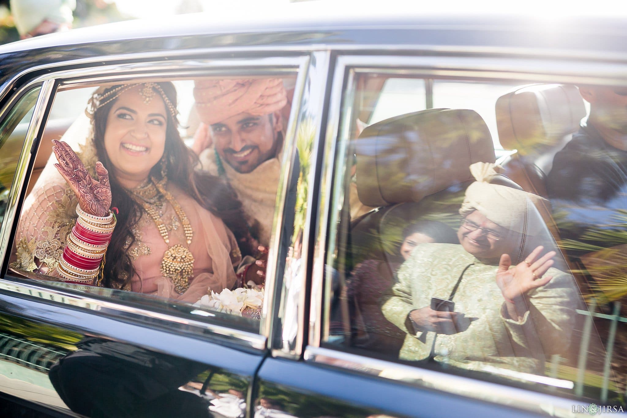 wedding newlyweds wave goodbye