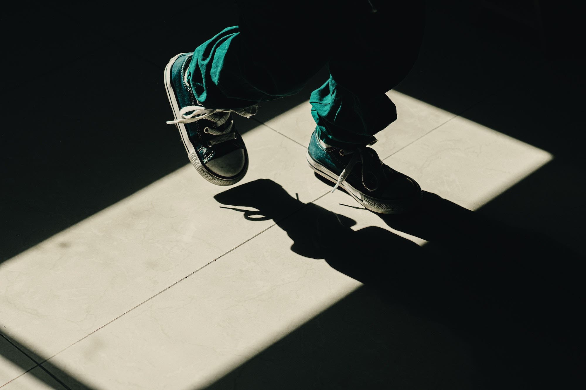 shadow photography with shoe in frame