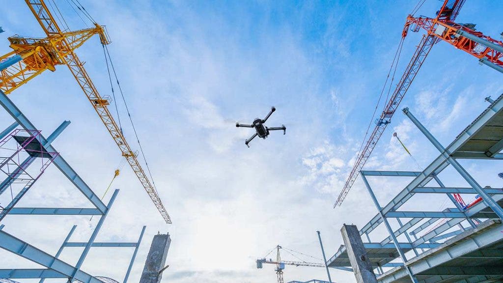 surveying drone flying above construction site