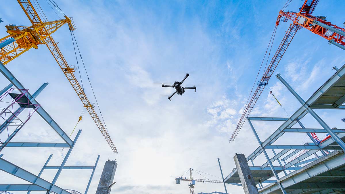 surveying drone flying above construction site