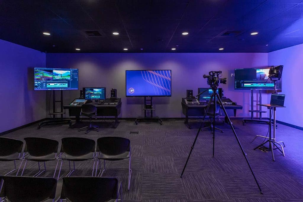 West Coast Baptist College video production studio setup with computers, monitors, and camera