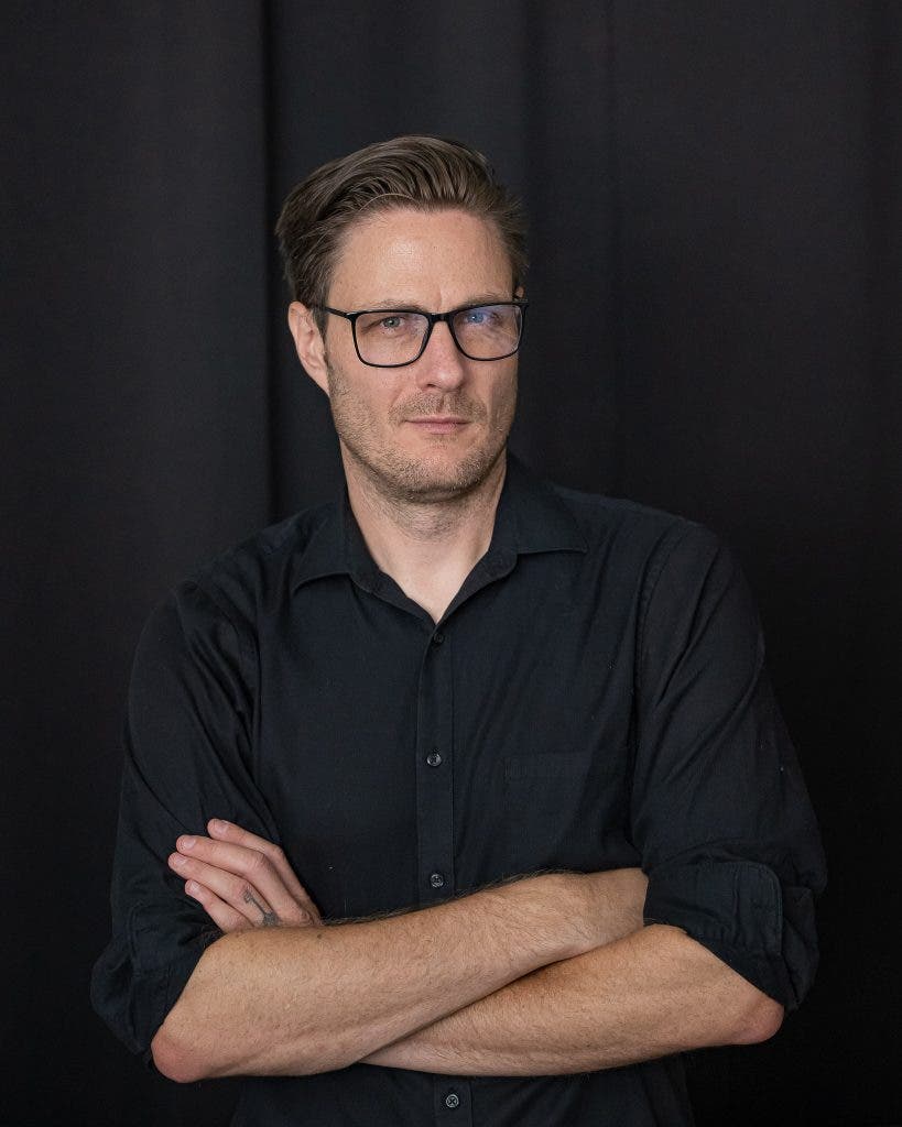 portrait of man in glasses at slight angle