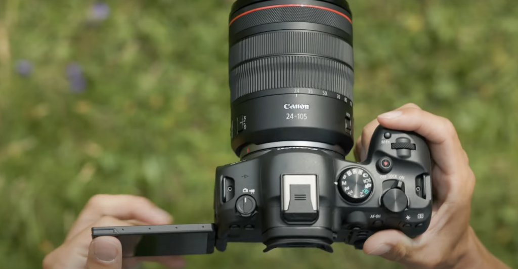 a picture of a canon camera against grass