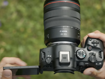 a picture of a canon camera against grass