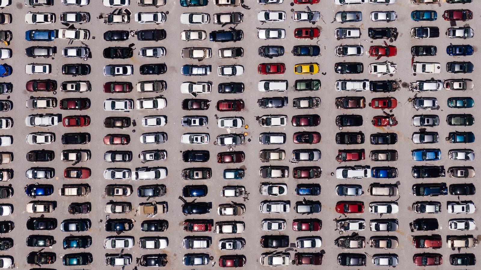 Top-down view of parking lot with cars
