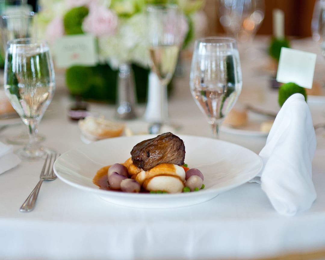 A steak sits in soft light