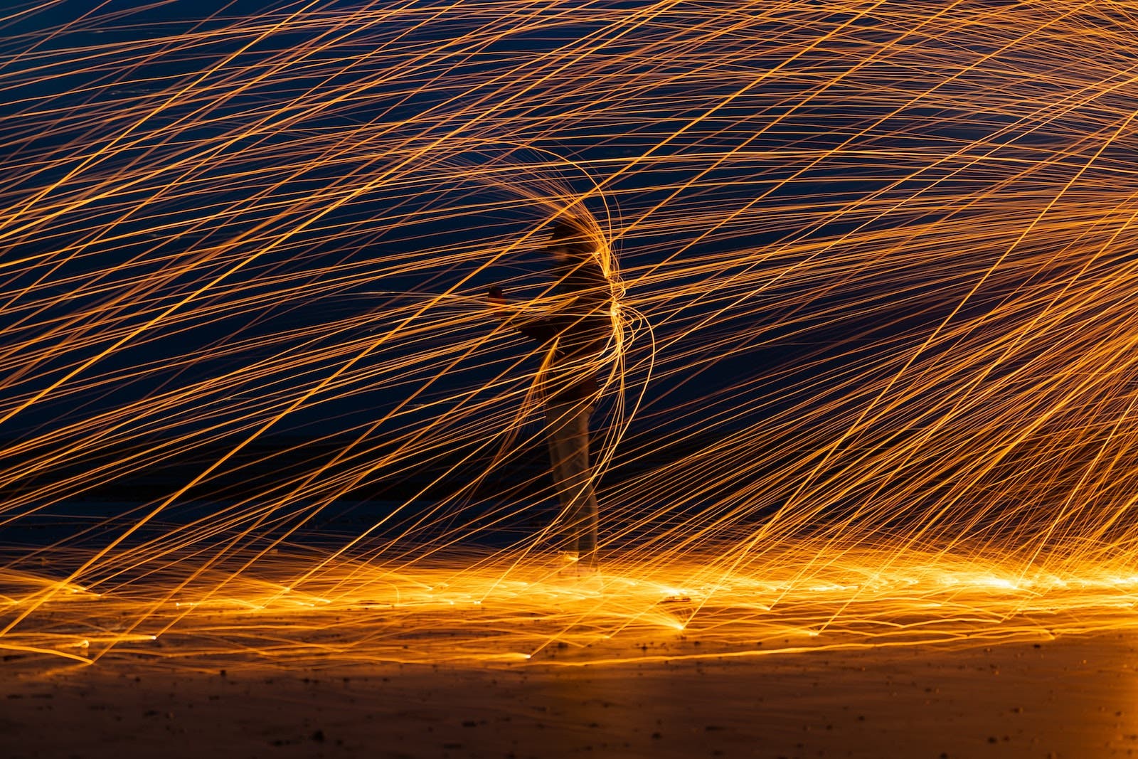 long exposure streaks with person under an umbrella