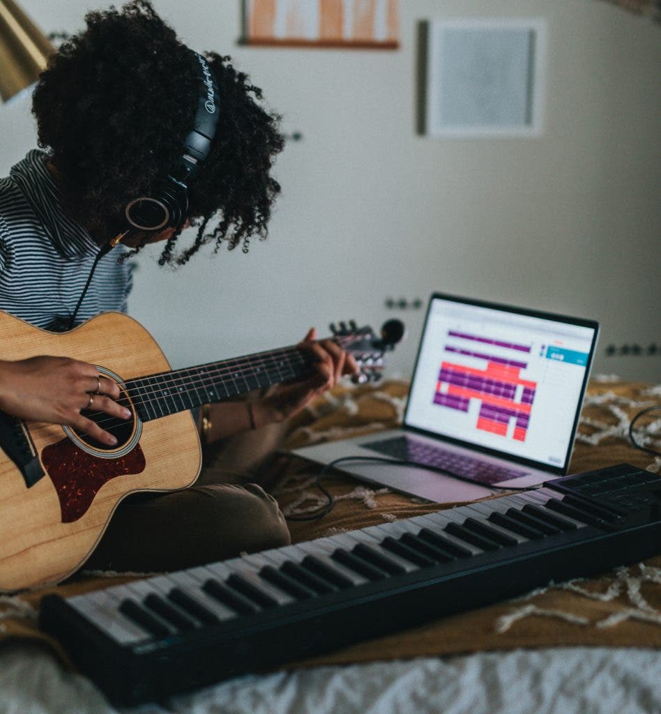 student musicians using instrument accessories in their dorm room