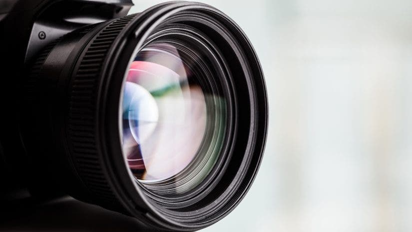 Close-up of a digital camera. Large copyspace